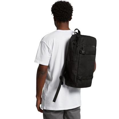 Person wearing a black backpack on a white background
