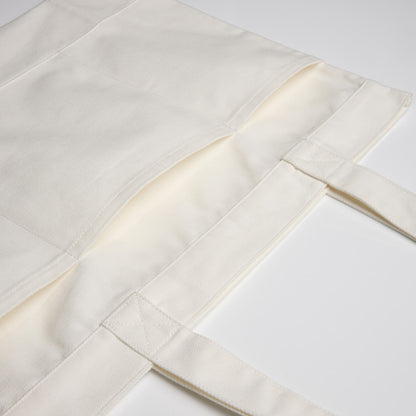Close-up of premium white patterned fabric texture, a high-quality blank apparel option for custom embroidery or Supacolor transfers in Christchurch.