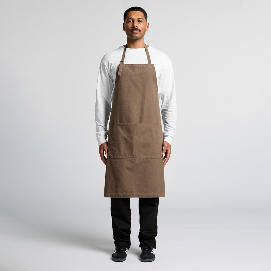 Professional male model wearing a blank chocolate brown bib apron, a stylish uniform choice for Christchurch cafes and barbershops offering custom embroidery or Supacolor branding.