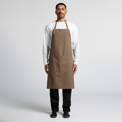 Professional male model wearing a blank chocolate brown bib apron, a stylish uniform choice for Christchurch cafes and barbershops offering custom embroidery or Supacolor branding.