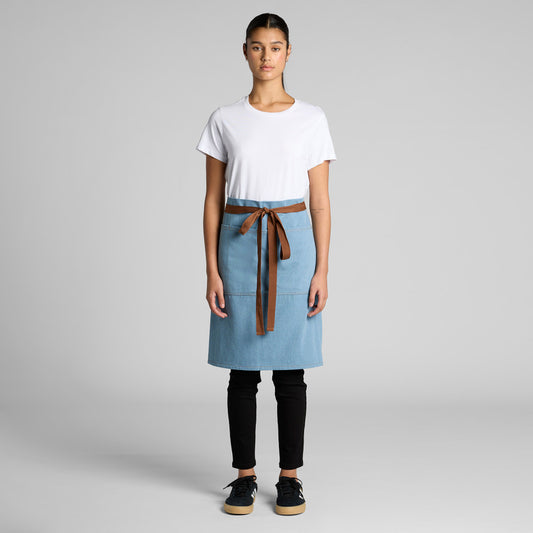 Person wearing a white shirt, black pants, and a blue apron with a brown belt on a gray background