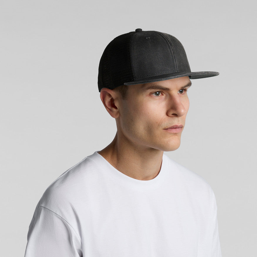 Man wearing a gray cap and white shirt against a light gray background