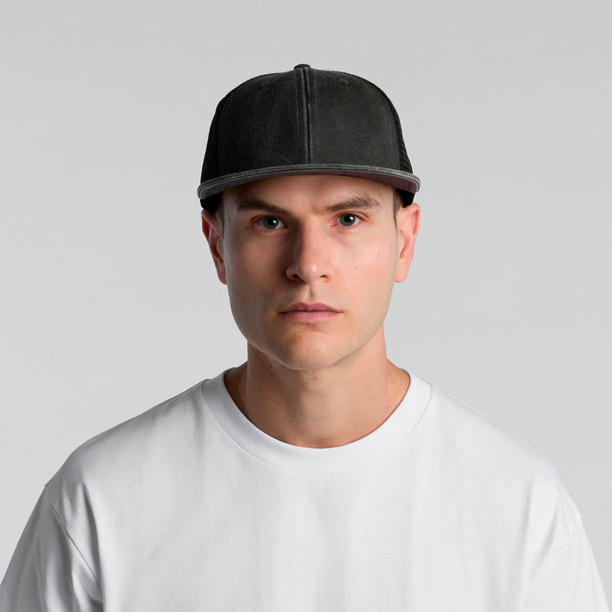 Man wearing a gray cap and white shirt against a light gray background