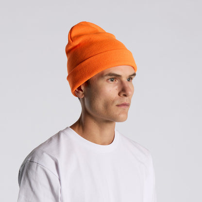 Person wearing an orange beanie and white shirt on a light gray background