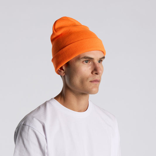 Person wearing an orange beanie and white shirt on a light gray background