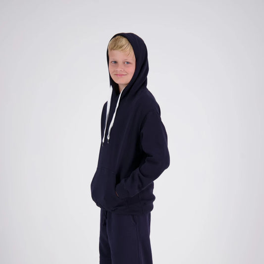 Child wearing a navy blue hoodie and pants on a white background