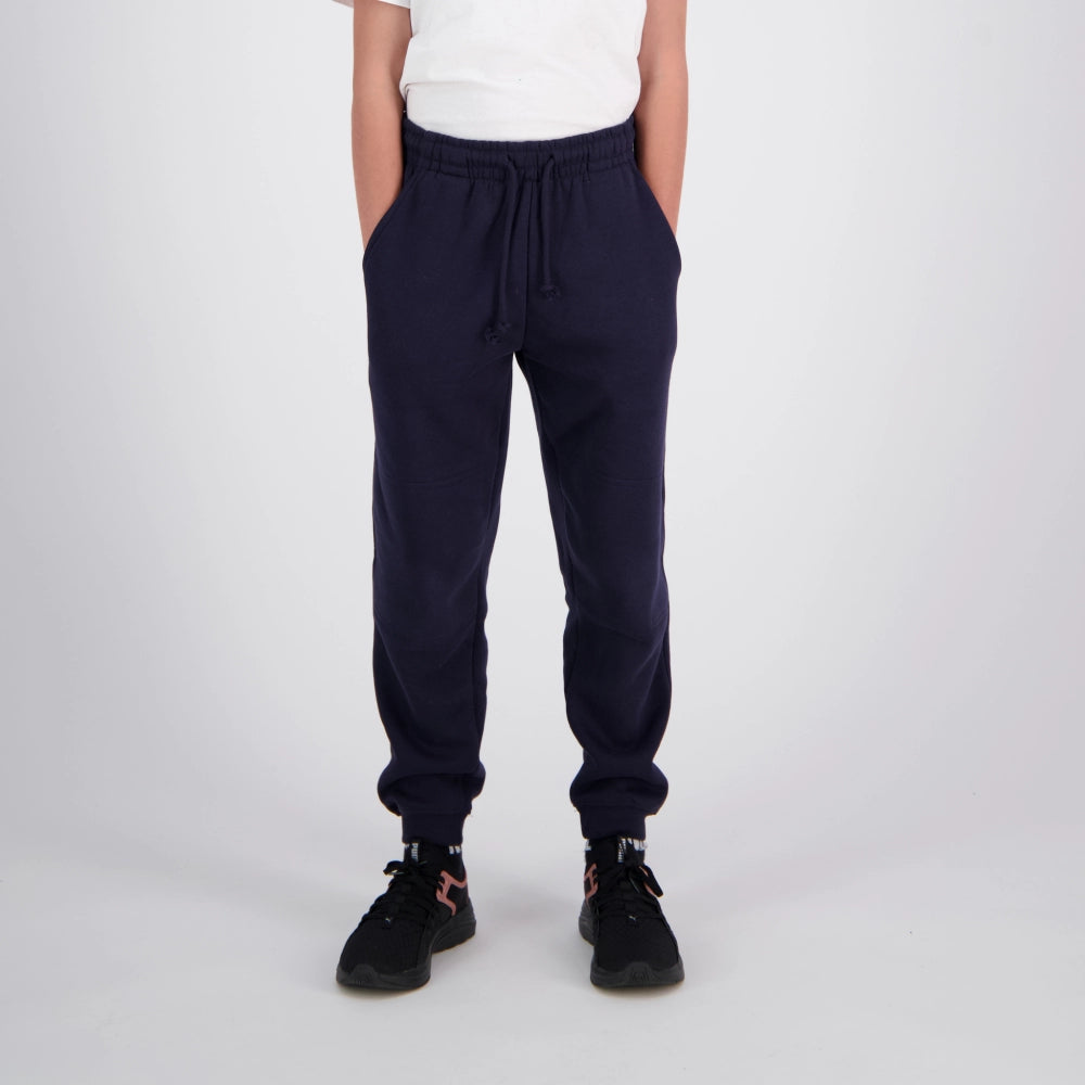 person wearing blue sweat pants white ground