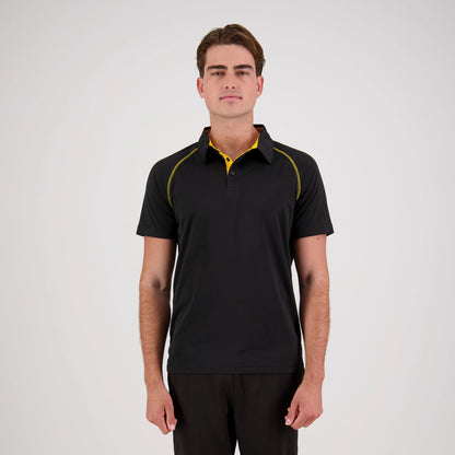 Man wearing a black polo shirt with yellow accents on a white background