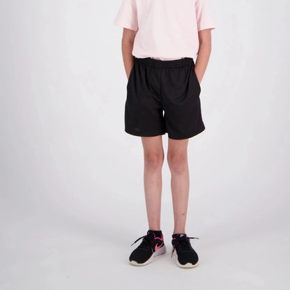 Person wearing black shorts and black sneakers on a white background